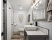 Modern bathroom with stylish fixtures and décor, including a vessel sink and decorative macrame at 4022 E 17Th Avenue Pkwy, Denver, CO 80220