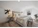 Cozy bedroom features stylish decor, soft lighting, and wood flooring at 4022 E 17Th Avenue Pkwy, Denver, CO 80220