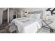 Inviting bedroom with contemporary decor, soft lighting, and a plush upholstered headboard at 4022 E 17Th Avenue Pkwy, Denver, CO 80220