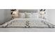Well-lit bedroom with decorative throws, comfortable bedding, and contemporary lamps at 4022 E 17Th Avenue Pkwy, Denver, CO 80220