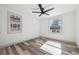 The bedroom has stylish wood floors and a contemporary ceiling fan at 4022 E 17Th Avenue Pkwy, Denver, CO 80220