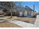 Charming gray and white two-story home with sidewalk leading to the front door at 4022 E 17Th Avenue Pkwy, Denver, CO 80220