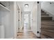 Hallway with hardwood floors leads to staircase at 4022 E 17Th Avenue Pkwy, Denver, CO 80220