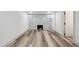 Spacious living room area with fireplace and stylish hardwood flooring throughout the space at 4022 E 17Th Avenue Pkwy, Denver, CO 80220