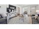 Open living area with stylish decor, including modern art and a patterned rug at 4022 E 17Th Avenue Pkwy, Denver, CO 80220