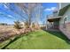 The backyard features a patch of artificial turf and a balcony for outdoor living at 15715 Carob Cir, Parker, CO 80134