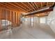The unfinished basement has concrete floors, exposed ceiling, and room for customization at 15715 Carob Cir, Parker, CO 80134