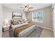 Bedroom with neutral carpet, soft bedding, and a large window at 15715 Carob Cir, Parker, CO 80134