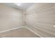 Walk-in closet with carpet and adjustable metal shelving at 15715 Carob Cir, Parker, CO 80134