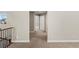 Carpeted hallway on the second floor offering a view of rooms at 15715 Carob Cir, Parker, CO 80134