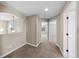 Upstairs hallway with neutral paint and carpet leading to bedrooms and other rooms at 15715 Carob Cir, Parker, CO 80134