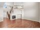 Living room with high ceilings, fireplace, and hardwood floors at 15715 Carob Cir, Parker, CO 80134