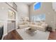 Living room showcasing high ceilings, large windows, and modern furnishings at 15715 Carob Cir, Parker, CO 80134