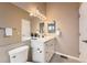 Bright bathroom features sleek countertop and modern fixtures, offering a clean and contemporary design at 18251 E Union Dr, Aurora, CO 80015