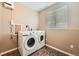 Convenient laundry room equipped with modern appliances for efficient laundry care at 18251 E Union Dr, Aurora, CO 80015