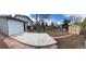 A spacious backyard with a shed, a patio, and stairs leading to a deck at 10630 Routt Way, Broomfield, CO 80021