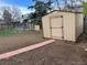 A clean backyard area featuring a storage shed, and dirt space for gardening at 10630 Routt Way, Broomfield, CO 80021
