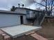 Backyard space featuring a deck with stairs and concrete patio area at 10630 Routt Way, Broomfield, CO 80021