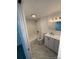 Bathroom featuring a shower-tub combo, toilet, vanity with sink and mirror, and marble flooring at 10630 Routt Way, Broomfield, CO 80021