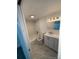 Bathroom featuring a shower-tub combo, toilet, vanity with sink and mirror, and marble flooring at 10630 Routt Way, Broomfield, CO 80021