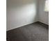 An empty bedroom with light walls, gray carpeting and a single window at 10630 Routt Way, Broomfield, CO 80021