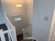 Bright entryway featuring a decorative door and staircase with white railing at 10630 Routt Way, Broomfield, CO 80021