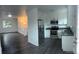 Modern updated kitchen flows to the living room with an open concept at 10630 Routt Way, Broomfield, CO 80021