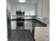Close up view of stainless steel microwave, new appliances, and plenty of cabinet space at 10630 Routt Way, Broomfield, CO 80021