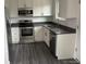 Updated kitchen featuring stainless steel appliances, white cabinetry, and granite countertops at 10630 Routt Way, Broomfield, CO 80021