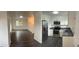Open floor plan view of the kitchen with new appliances and living room at 10630 Routt Way, Broomfield, CO 80021