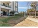 View of fenced backyard from patio, with gated access to the carport at 2375 S Linden Ct # 118, Denver, CO 80222