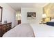 Relax in this bedroom featuring hardwood floors and en-suite bath at 2375 S Linden Ct # 118, Denver, CO 80222