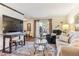 Cozy living room with natural light and comfortable seating arrangement at 2375 S Linden Ct # 118, Denver, CO 80222