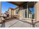 Covered deck with black metal railings overlooking the backyard at 13015 Tamarac Pl, Thornton, CO 80602
