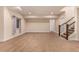 Finished basement with carpeted floor, stairwell, and a single window at 13015 Tamarac Pl, Thornton, CO 80602