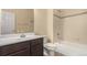 Bathroom featuring a vanity, toilet and a tiled shower and bathtub combo at 13015 Tamarac Pl, Thornton, CO 80602