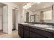 Bathroom with double granite vanity, ample storage and a glass-enclosed shower at 13015 Tamarac Pl, Thornton, CO 80602
