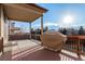 View of a covered deck with an outdoor grill, perfect for entertaining and enjoying outdoor living at 13015 Tamarac Pl, Thornton, CO 80602