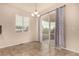 A spacious dining room featuring tile flooring with sliding glass doors to a covered patio at 13015 Tamarac Pl, Thornton, CO 80602