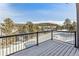 Wood deck surrounded by black metal railing showcasing stunning views at 31008 Big Bear Dr, Evergreen, CO 80439