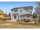 Expansive backyard with patio, gazebo, and outdoor furniture, ideal for entertaining and outdoor enjoyment at 4027 Hawthorne Cir, Longmont, CO 80503