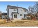 Large backyard featuring a covered patio, outdoor furniture, and plenty of space for activities and relaxation at 4027 Hawthorne Cir, Longmont, CO 80503