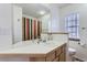 Bathroom featuring a long vanity counter and a shower with a colorful curtain at 4027 Hawthorne Cir, Longmont, CO 80503