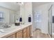 Bright bathroom featuring a double sink vanity, a soaking tub, and a separate shower stall at 4027 Hawthorne Cir, Longmont, CO 80503