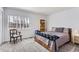 Bedroom featuring carpet, a window view, and a bookshelf at 4027 Hawthorne Cir, Longmont, CO 80503