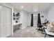 A bright office space with carpet, a closet, and built-in shelving providing storage and organization at 4027 Hawthorne Cir, Longmont, CO 80503