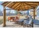 Charming covered patio with outdoor seating, perfect for relaxing and enjoying the backyard views at 4027 Hawthorne Cir, Longmont, CO 80503