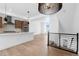 Open floor plan with modern kitchen, hardwood floors, and stylish lighting fixtures at 14241 Currant, Broomfield, CO 80020
