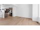 Open living area with hardwood flooring, natural light, and open kitchen access at 14241 Currant, Broomfield, CO 80020