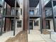 Modern townhome exterior featuring private balconies and a contemporary brick and wood facade at 1652 N Lafayette St # 6, Denver, CO 80218